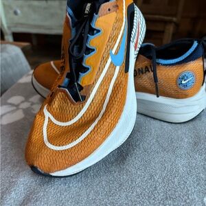 Nike Orange and Blue Athletic Shoes with Retro Design